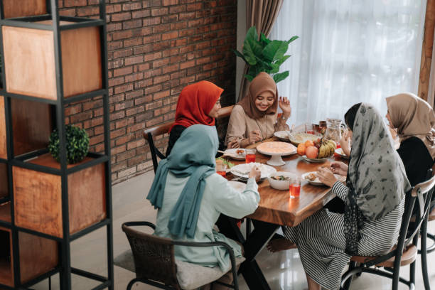 istock muslim people having dinner break fasting together 1148177560