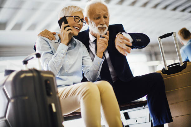 istock Business couple waiting on the train. 1148177821