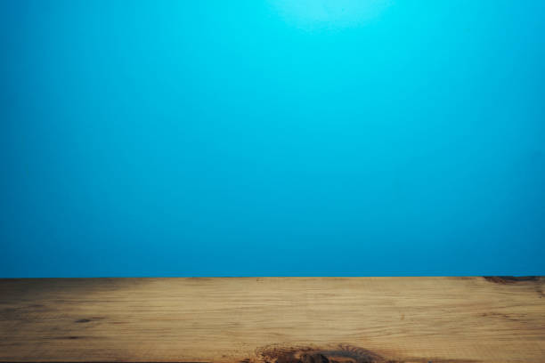 istock Beautiful brown wooden table and blue wall background. 1148177966