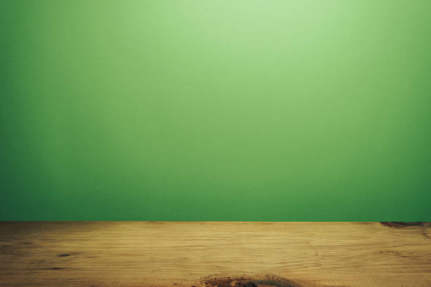 istock Beautiful brown wooden table and green wall background. 1148177977