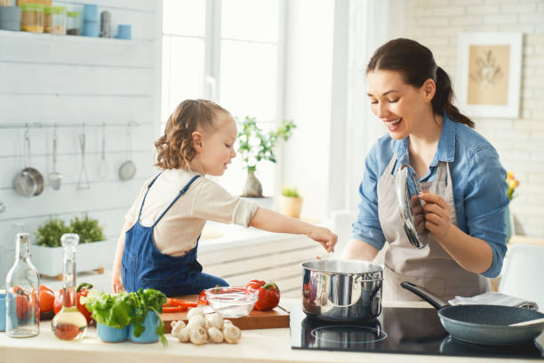 istock Happy family in the kitchen. 1148183713