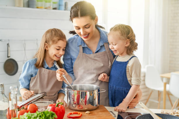 istock Happy family in the kitchen. 1148183720