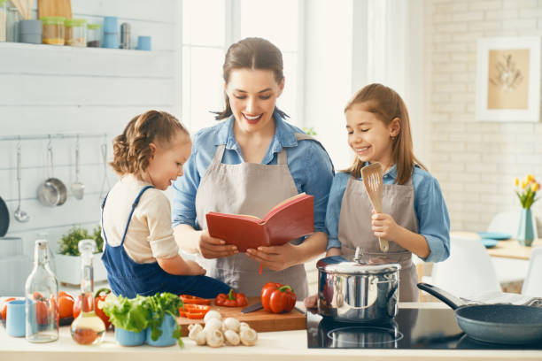 istock Happy family in the kitchen. 1148183723