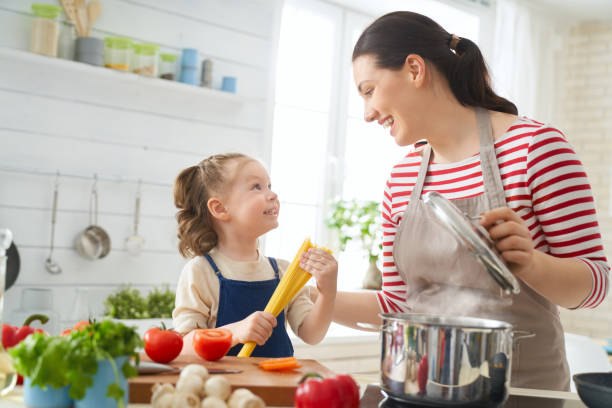 istock Happy family in the kitchen. 1148183745