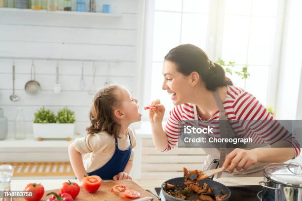 Happy Family In The Kitchen Stock Photo - Download Image Now - Cooking, Family, Mother