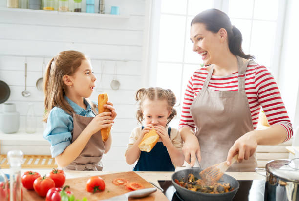 istock Happy family in the kitchen. 1148183763