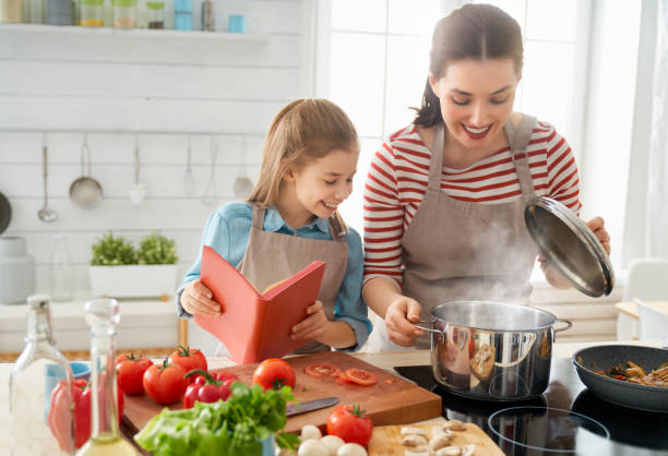 istock Happy family in the kitchen. 1148183769