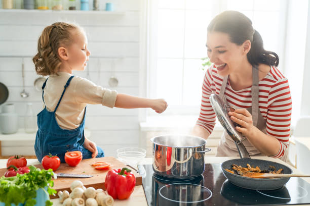 istock Happy family in the kitchen. 1148183782