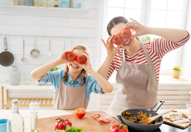 istock Happy family in the kitchen. 1148183789