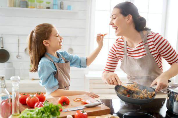istock Happy family in the kitchen. 1148183797