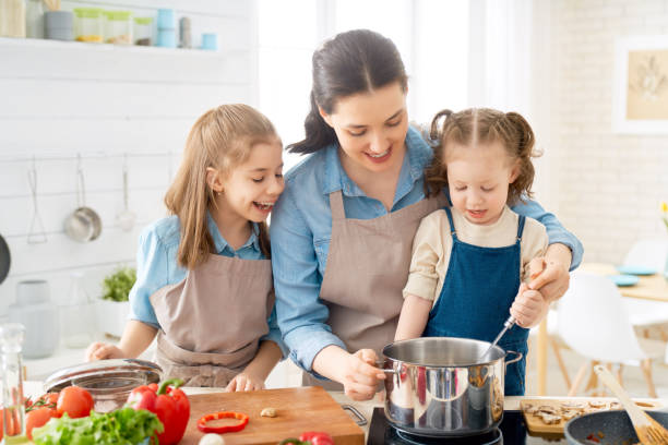 istock Happy family in the kitchen. 1148183799