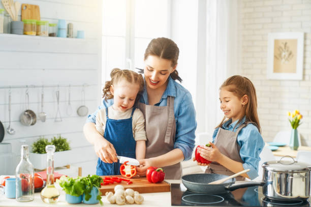 istock Happy family in the kitchen. 1148183827