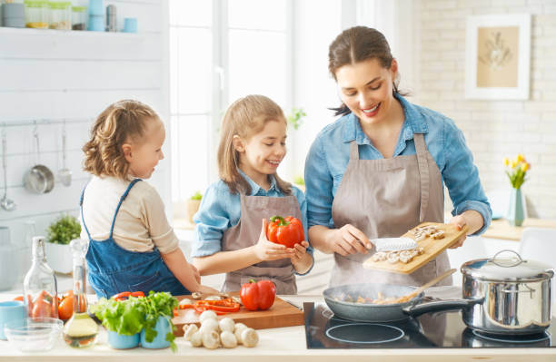 istock Happy family in the kitchen. 1148183840
