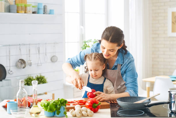 istock Happy family in the kitchen. 1148183856