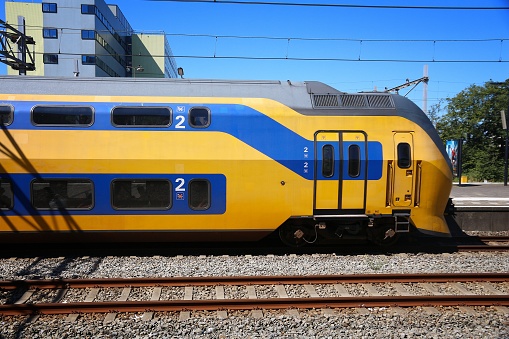 Nederlandse Spoorwegen (NS) train in Zaandam. NS is the principal Dutch public railway company, operating 4,800 domestic trains daily.