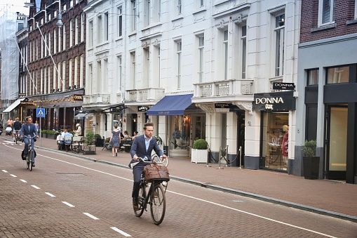 People visit P.C. Hooftstraat in Amsterdam. Pieter Cornelis Hooftstraat is the ultimate upscale shopping street in the Netherlands.