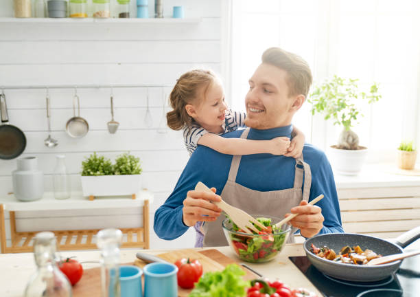 istock Happy family in the kitchen. 1148189477