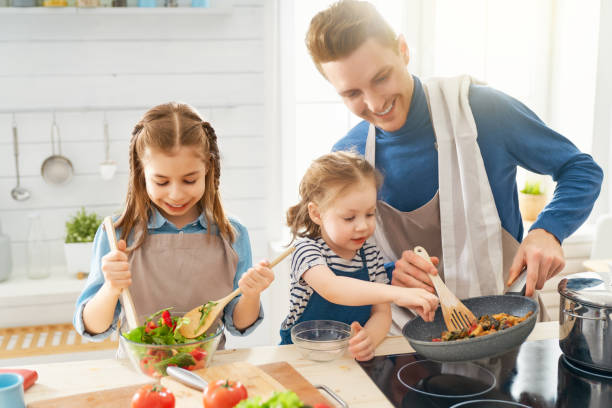 istock Happy family in the kitchen. 1148189488