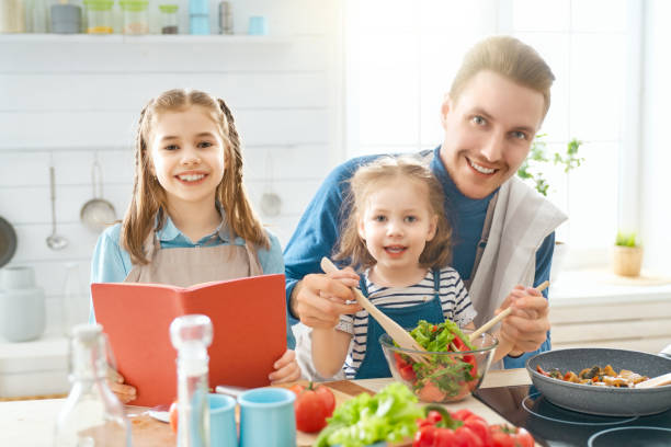 istock Happy family in the kitchen. 1148189515