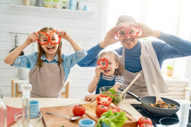 istock Happy family in the kitchen. 1148189516