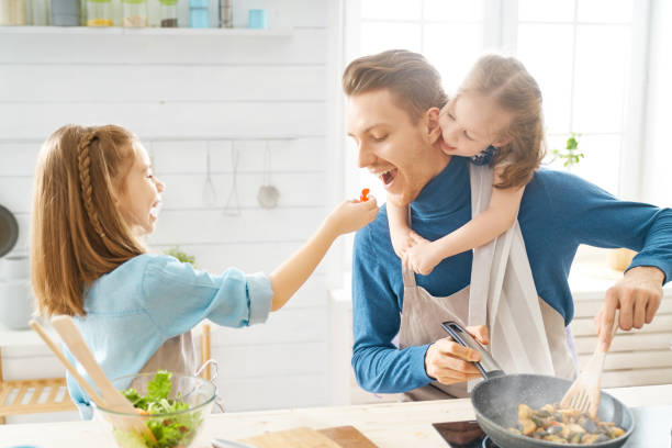 istock Happy family in the kitchen. 1148189565