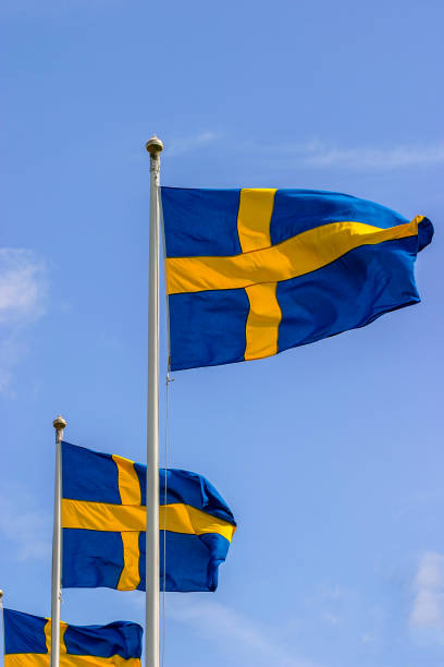 istock Swedish flags against the blue sky 1148189827