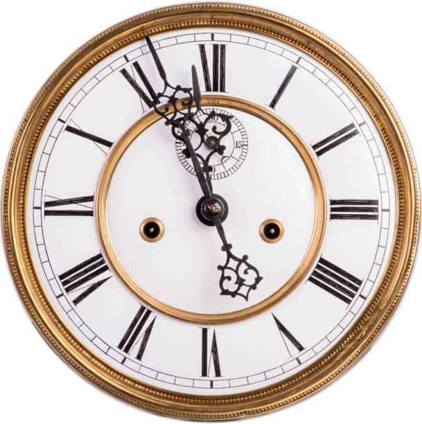 istock Old antique clock face with roman numeral isolated on white 1148194878