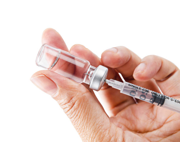 istock Syringe, medical injection vaccination in hand 1148195288