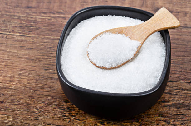 istock Monosodium glutamate in black bowl 1148195562