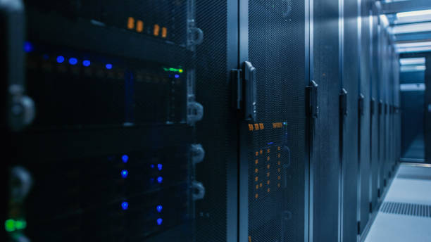 istock Close-up Shot of Data Center With Rows of Fully Operational Server Racks. Concept of Telecommunications, Cloud Computing, Artificial Intelligence, Database, Supercomputer Technology. 1148195943