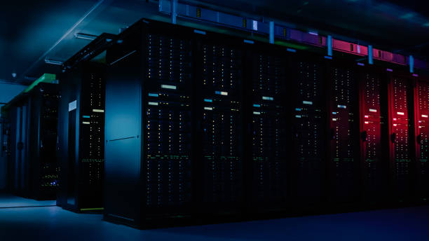 istock Descending Shot of Data Center With Multiple Rows of Fully Operational Server Racks. Modern Telecommunications, Cloud Computing, Artificial Intelligence, Database, Supercomputer Technology Concept. 1148196195