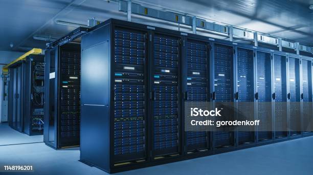 Shot Of Modern Data Center With Multiple Rows Of Operational Server Racks Modern Hightech Database Super Computer Clean Room Stock Photo - Download Image Now