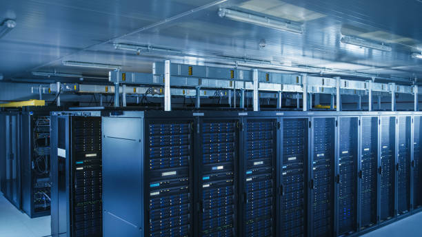 istock Descending Shot of Modern Data Center With Multiple Rows of Operational Server Racks. Modern High-Tech Database Super Computer Clean Room. 1148196212