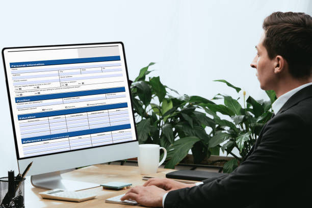 istock man in suit filling in Personal Information Application, Identity Private Concept 1148199928