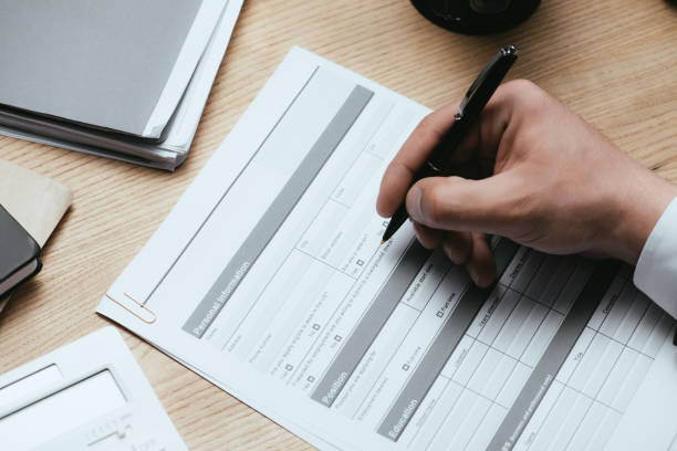 istock cropped view of man filling in Personal Information Application Identity Private Concept 1148200075