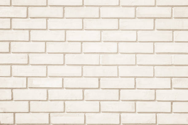 istock Cream colors and white brick wall art concrete or stone texture background. 1148203829