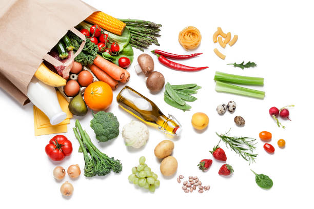 paper bag full of different food on white background - isolated isolated on white studio shot food imagens e fotografias de stock