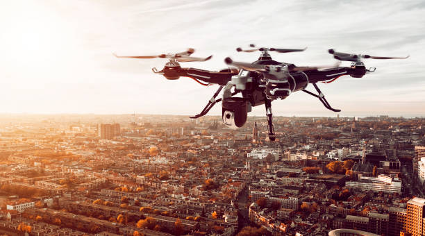 istock Drone with camera hoovers over city ready to take photos or video 1148205167