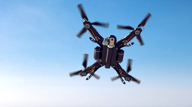 istock Drone flys through the air filming with video camera on a clear blue sky 1148205194