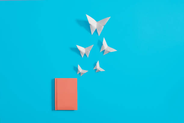 Orange notebook with origami butterflies
