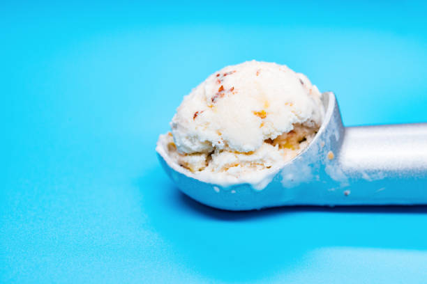 istock spoon with chestnut and red bean ice cream ball on blue background 1148205315