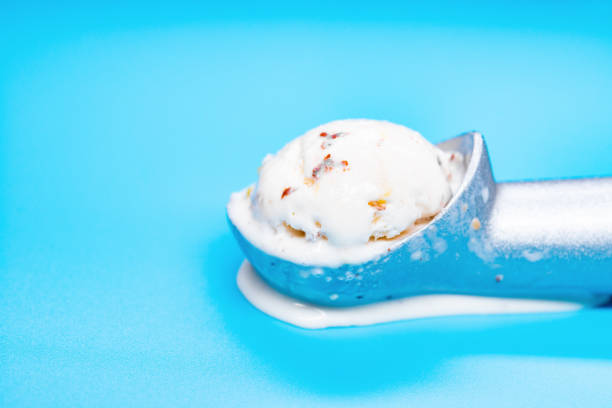 istock chestnut and red bean ice cream starts melting and spliting out on blue background 1148205445