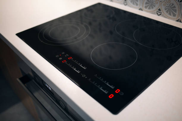 istock New electric stove with induction cooktop in kitchen, closeup 1148205461