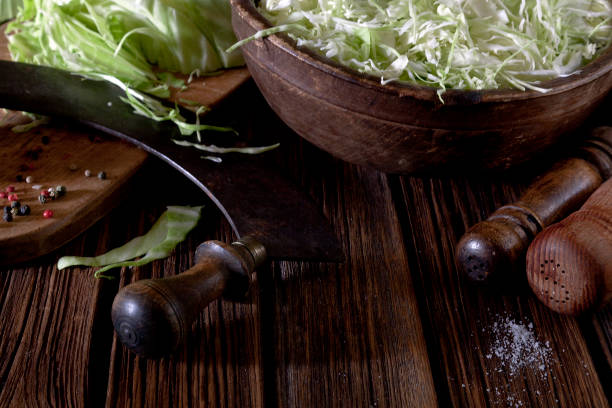 istock Shredded head of cabbage on rustic wooden background. Close up, top view 1148205780