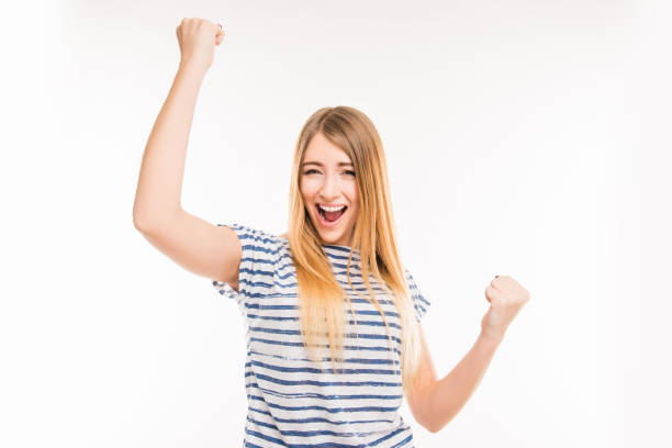 istock Happy girl with raised fists 1148208058
