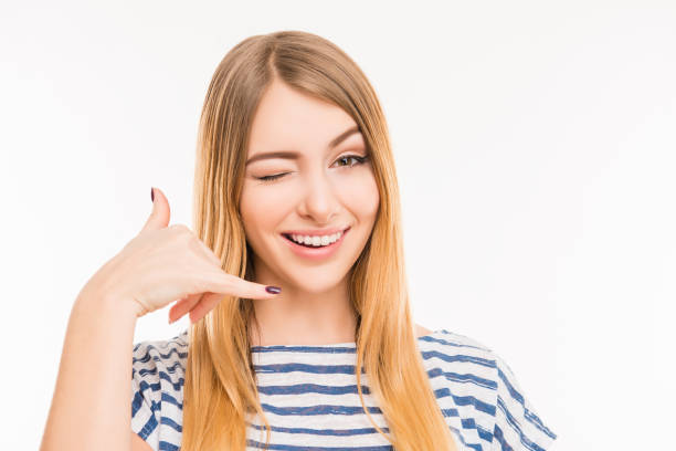 istock Smiking girl asking to call her 1148208063