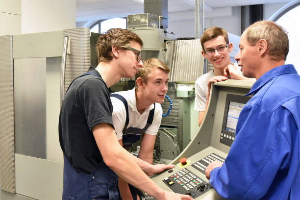 istock Group of young people in technical vocational training with teacher 1148208516