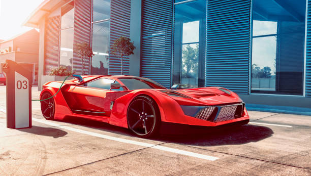 el coche deportivo eléctrico consigue energía para las baterías a través de la estación de carga - charging battery electricity power line fotografías e imágenes de stock