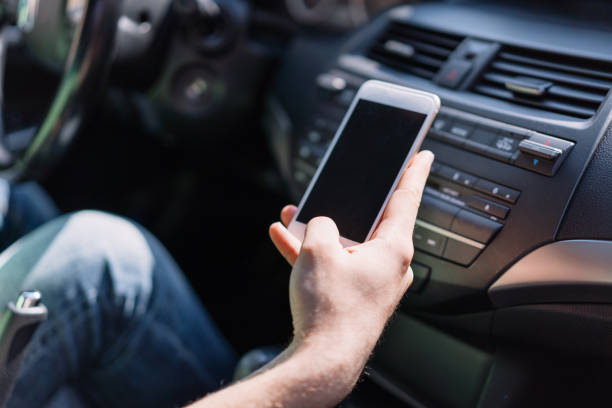 istock Driver pairing his mobile phone with the car 1148212387