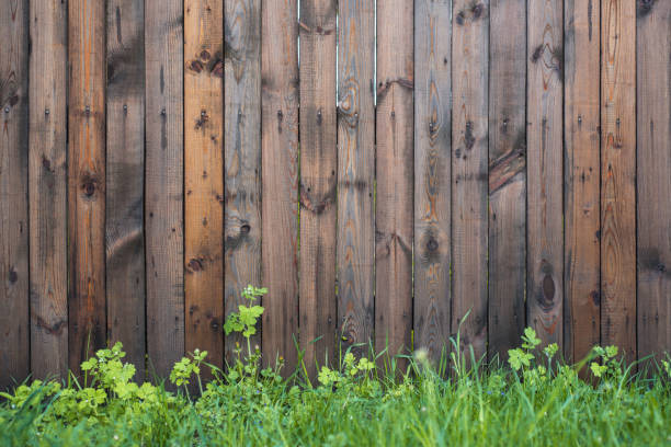 istock Wooden fence with grass. Vintage texture Background. 1148212589